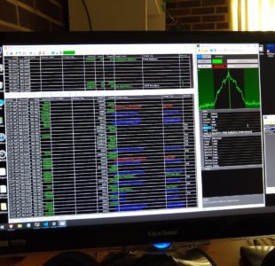 Unitrunker running on a desktop monitor, its trunked-radio channel tables filled with colour-coded activity.